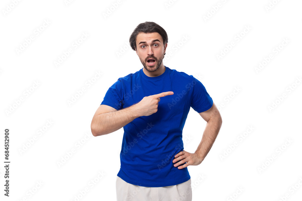 young authentic brunette man with a beard in a blue t-shirt on a white background with copy space young authentic brunette man with a beard in a blue t-shirt on a white background with copy space
