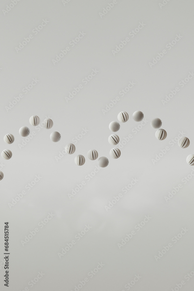 3D render of row of striped spheres floating against white background 3D render of row of striped spheres floating against white background