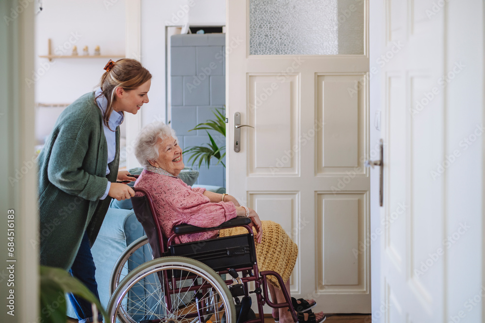 © Westend61 - Healthcare worker with senior woman sitting in wheelchair at home