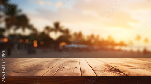Wooden table top on blur beach cafes background