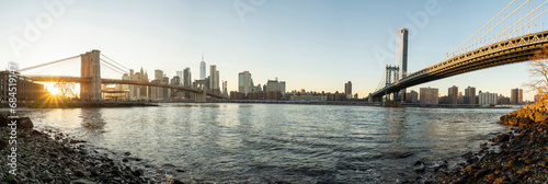 Famous bridges connecting Manhattan skyline to Dumbo district, New York City photo