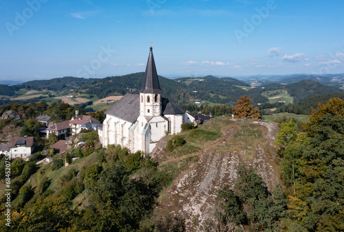 Austria, Upper Austria, Sankt Thomas am Blasenstein, Drone view of rural church and surrounding hills photo