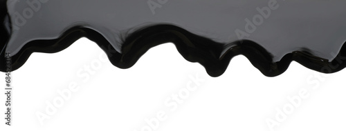Black viscous liquid flowing on white background