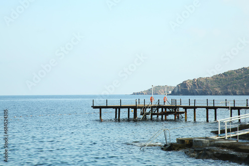 Fototapeta Naklejka Na Ścianę i Meble -  Picturesque view of sea and pier under blue sky