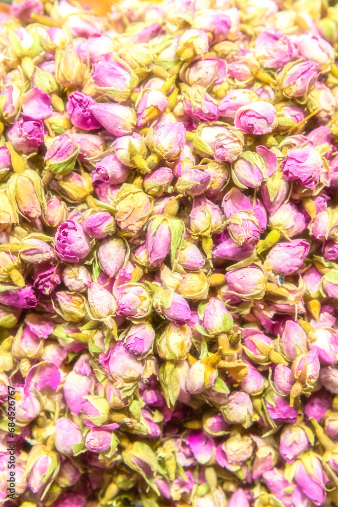 Herbal tee sold at Egypt Bazaar (Misir Carsisi) in Istanbul, Turkey (Turkiye). Multicolor rose blossoms. Selected focus, copy space, colorful vertical background
