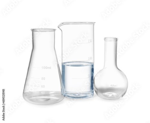 Glass flasks and beaker with water isolated on white