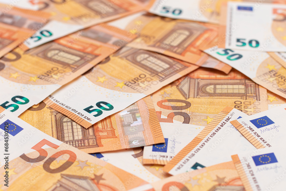 50 Euro Banknotes Money Background. Euro Money Currency. Orange Paper Money. A Lot of Fifty Euro Bills. Business, Finances, Cash and Money Saving Concept 50 Euro Banknotes Money Background. Euro Money Currency. Orange Paper Money. A Lot of Fifty Euro Bills. Business, Finances, Cash and Money Saving Concept