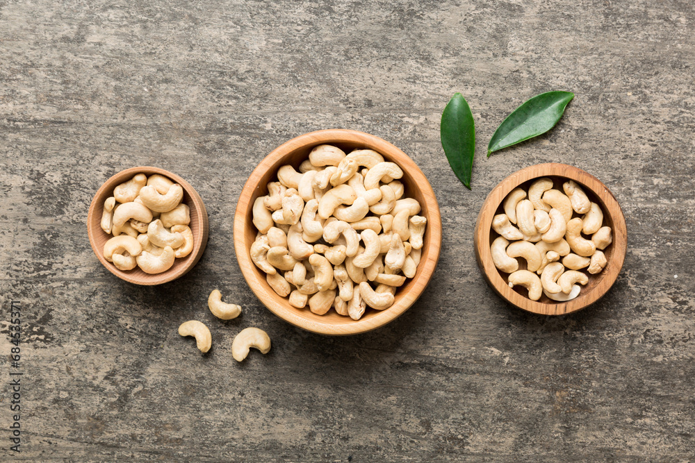 cashew nuts in wooden bowl on table background. top view. Space for text Healthy food cashew nuts in wooden bowl on table background. top view. Space for text Healthy food