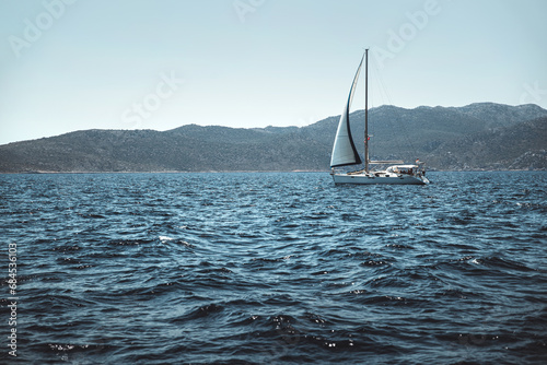 Beautiful sea landscape with little sailboat on it