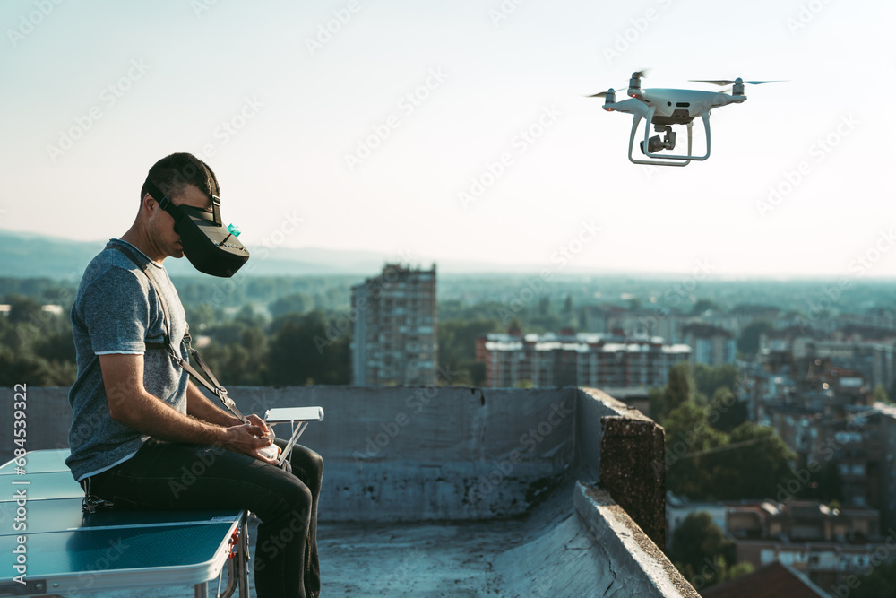 Man with drone flying at the city Man with drone flying at the city