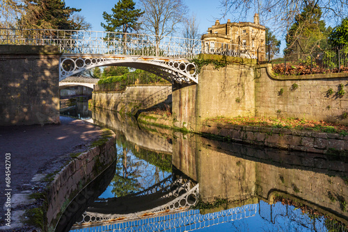 Grade II listed decorative iron footbridges over the Kennet and Avon Canal at Sydney Gardens in Bath, Somerset, England  photo