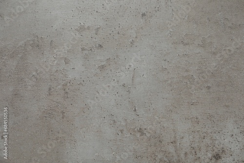 Texture of light grey stone surface as background, closeup