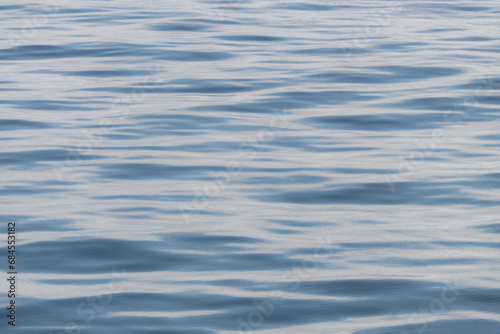 Small ocean waves and ripples creating an abstract pattern