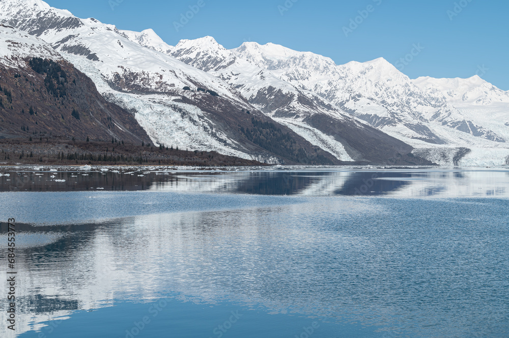 Tidewater Glacier reflected in the calm waters of College Fjord, Alaska, USA