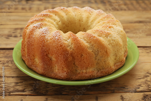 Konstfotografi Delicious freshly baked sponge cake on wooden table, closeup