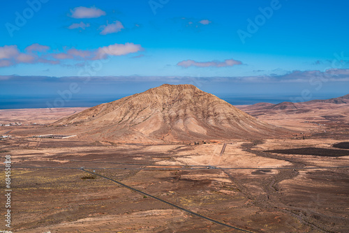 View of the sacred mountain of Tindaya, one of the highest on the island. Photography taken in Fuerteventura, Canary Islands, Spain.