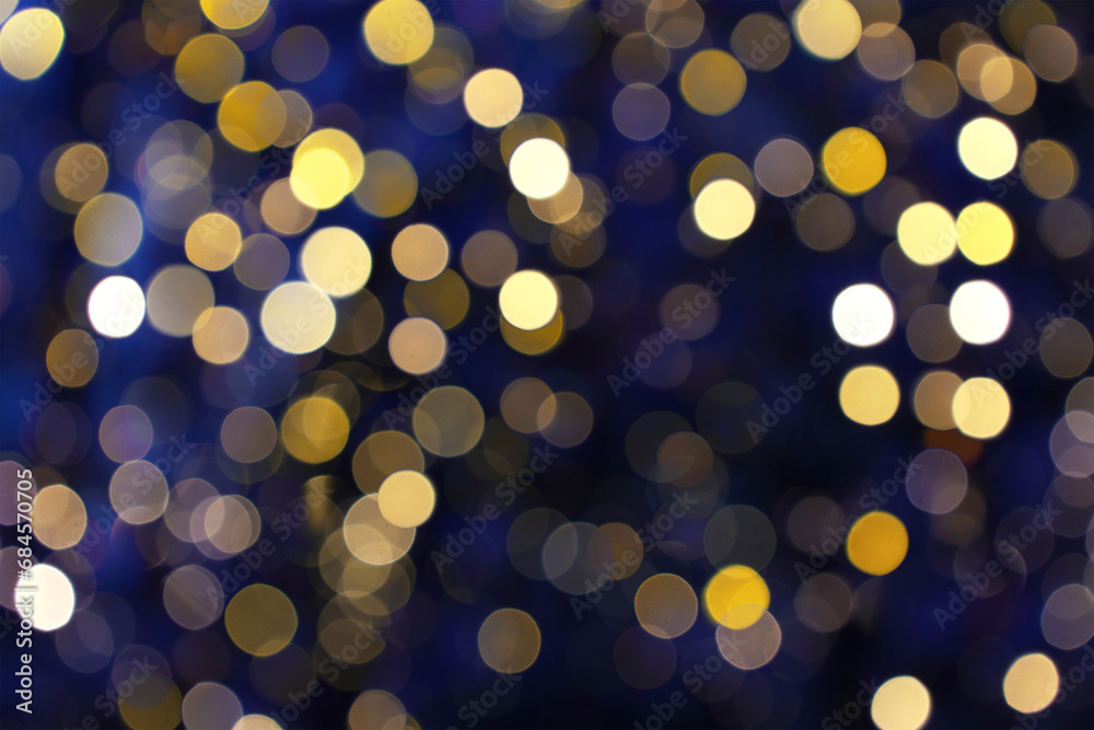 Abstract background with Christmas tree garland warm lights. Yellow blurred bokeh lights of holiday decoration illumination in city center. Shiny defocused bokeh circles, dark blue backdrop. Abstract background with Christmas tree garland warm lights. Yellow blurred bokeh lights of holiday decoration illumination in city center. Shiny defocused bokeh circles, dark blue backdrop.