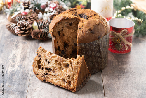 Christmas panettone cake with chocolate chips on wooden table