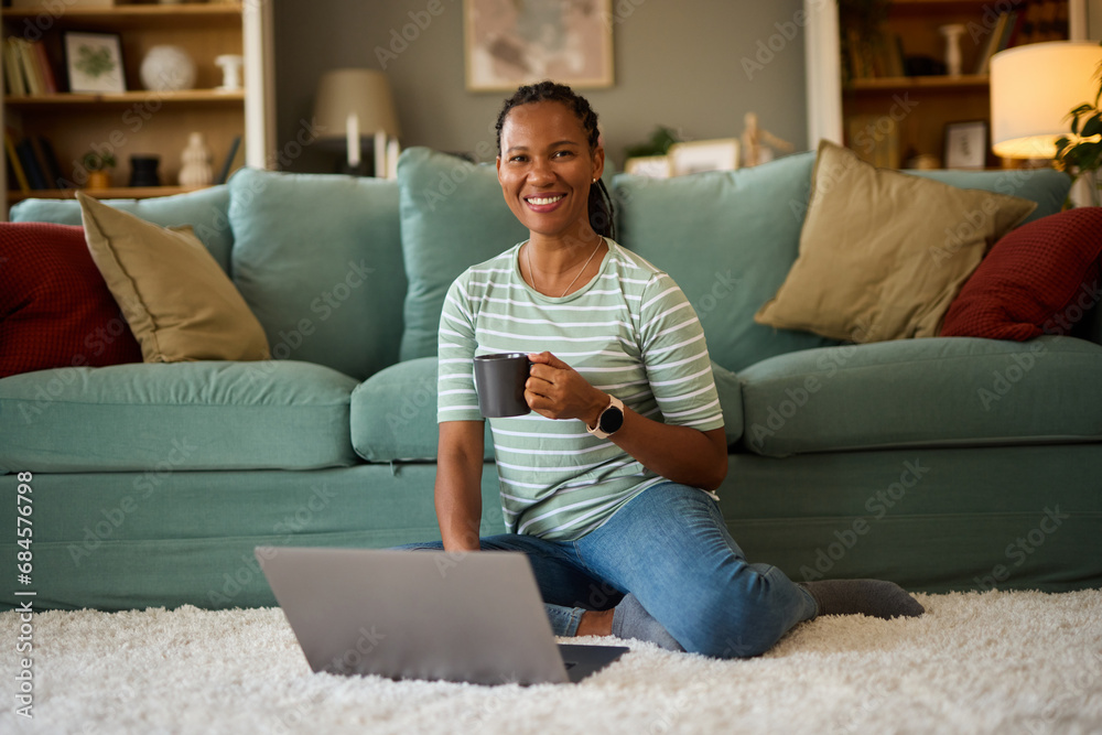 Happy african american woman with laptop at home Happy african american woman with laptop at home