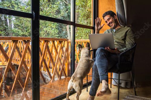 man working via video call