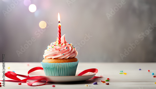 Birthday cupcake with lit birthday candle. Photography set composition. photo