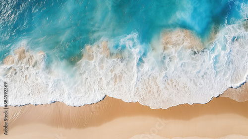 Aerial beach top view above seashore with blue wave