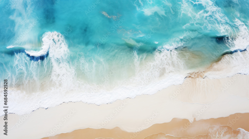 Aerial beach top view above seashore with blue wave