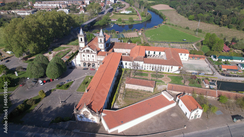 Santo Tirso, Portugal, April 16, 2022: Aerial view of the Abade Pedrosa Municipal Museum and the Monastery of St. Benedict (Sao Bento) in the city of Santo Tirso, with the Ave River in the background. photo