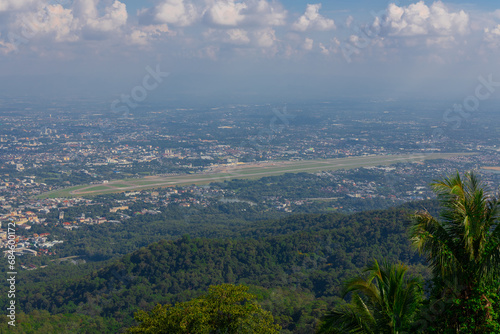 Panorama view of Chiangmai Chiang Mai city taken from Doi Suthep Mountains. Lovely views of the Old city at Sunset Sunrise lovely tropical mountains and beautiful nature in the foreground