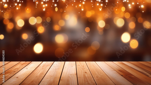 Empty wooden table with blurry lights in the background