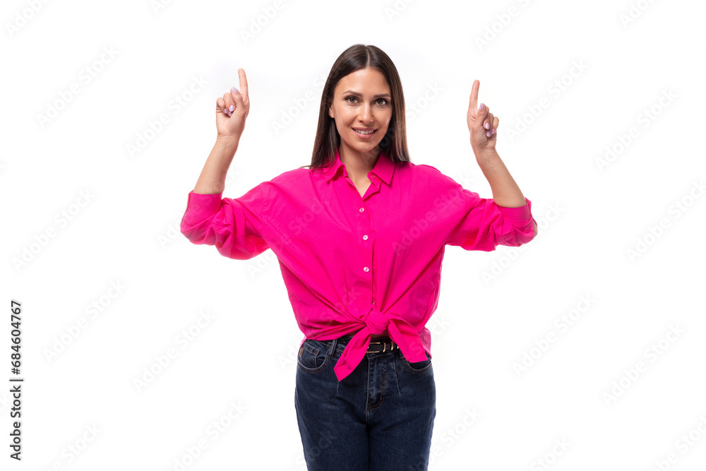 young confident strong brunette woman leader wears a bright pink shirt on a white background young confident strong brunette woman leader wears a bright pink shirt on a white background