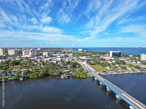 Aerial view of the newly built train tracks over Crane Creek leading to the Indian River and yacht harbor in historic downtown Melbourne along Florida's Space Coast in Brevard County