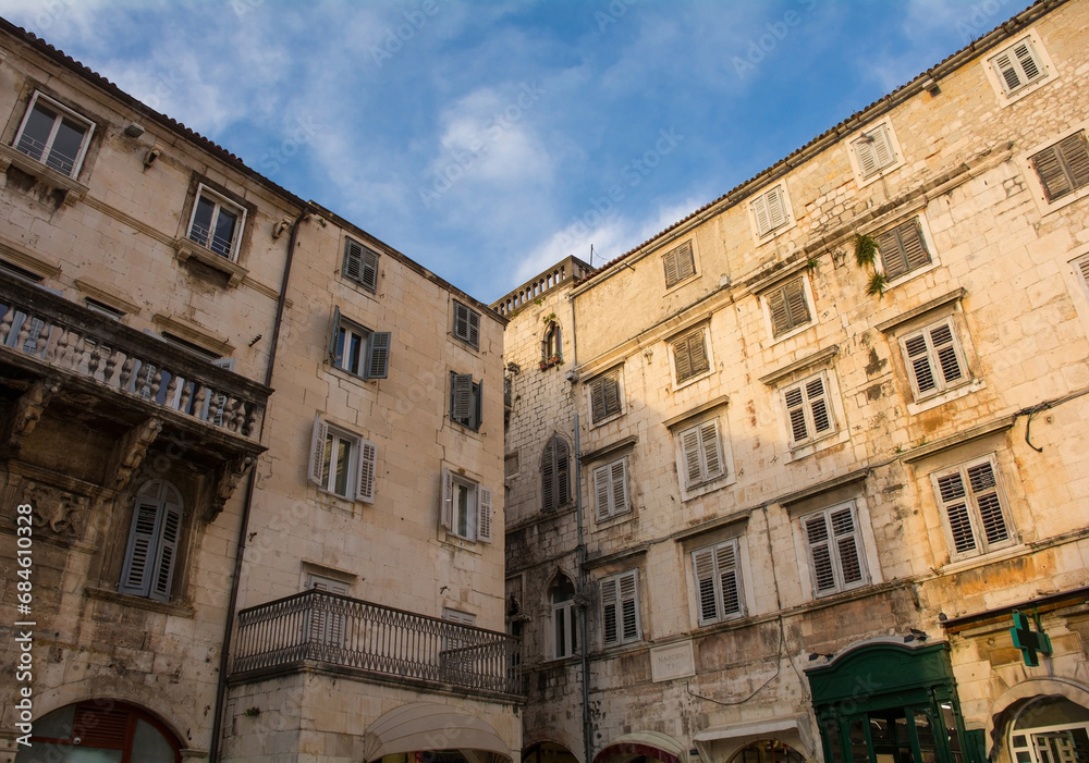 Historic residential buildings above shops in Narodni Trg square in Split Old Town
