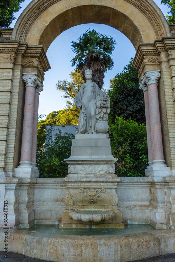 Seville, Spain, September 11, 2021: The Fuente Glorieta de San Diego fountain is located in one of the entrances to the María Luisa park in Seville, nearby Spain Plaza.