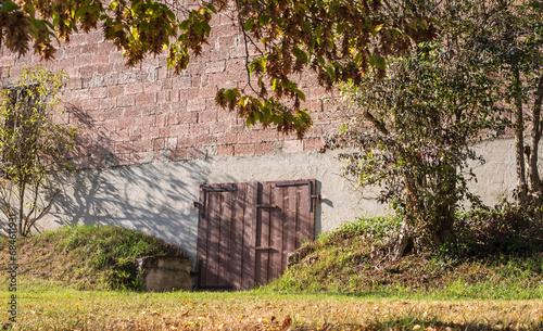 a wooden gate in a barn