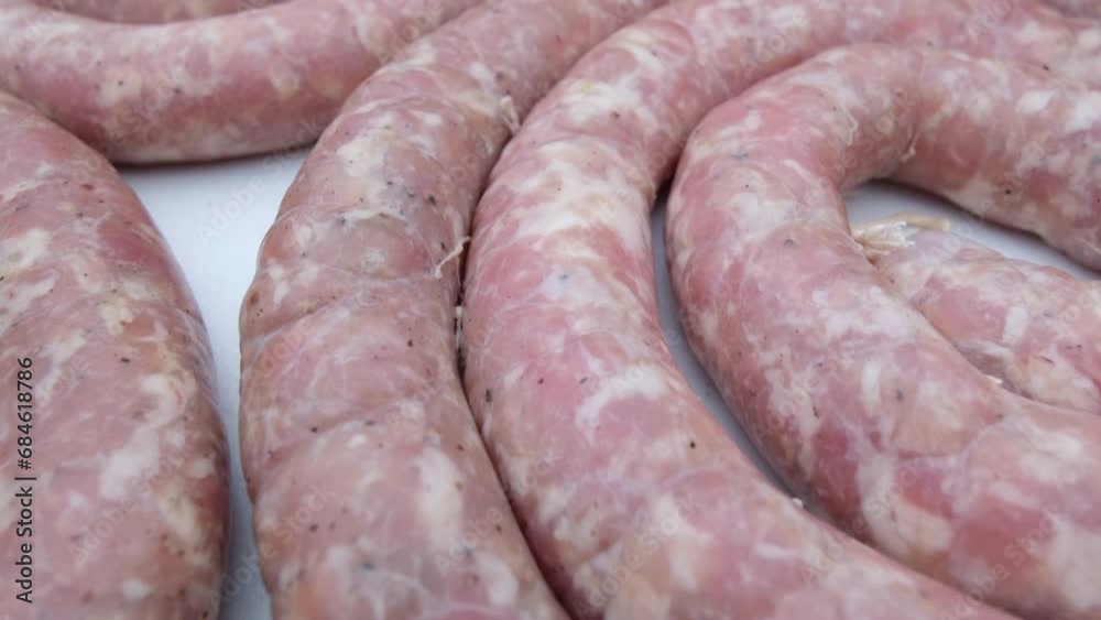 Extreme close up of raw sausage rings or freshly stuffed sausage casings ready to be smoked in back yard home made smoker. Extreme close up of raw sausage rings or freshly stuffed sausage casings ready to be smoked in back yard home made smoker.