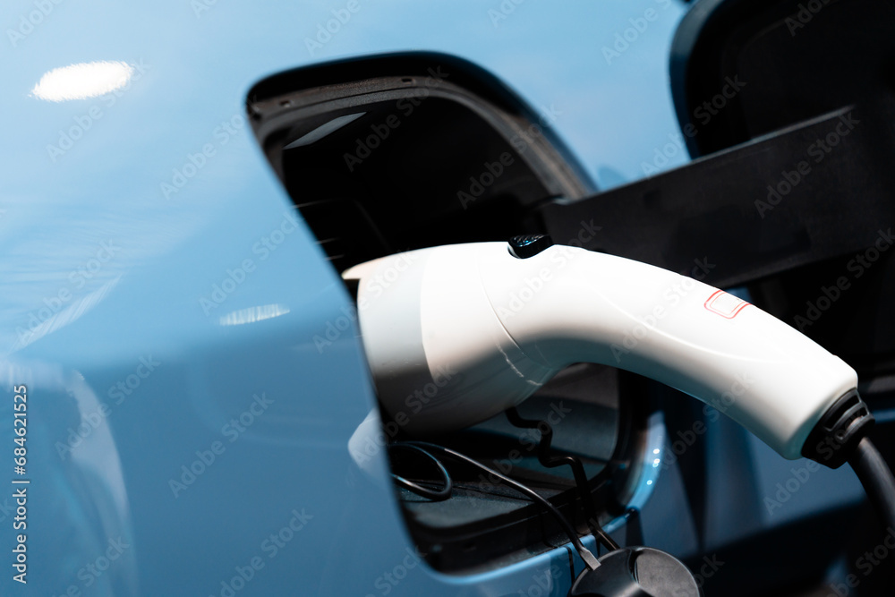 Electric car is charging in power station Electric car is charging in power station