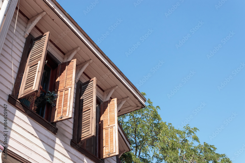 Wooden window with grille of wooden house