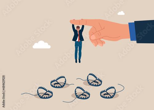 Businessman hangs on for dear life from a behind the big finger hand as he swings above a many steel bear trap. Avoid pitfall, and business failure. Flat vector illustration. 