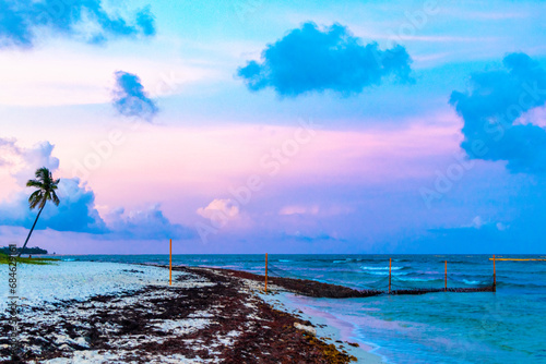 Fototapeta Naklejka Na Ścianę i Meble -  Awesome sunset at tropical Caribbean beach Playa del Carmen Mexico.