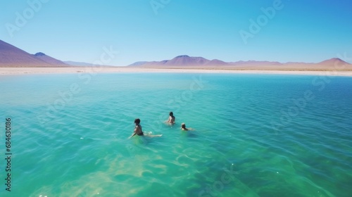 people swimming in the clear blue water of the bosque de boliva