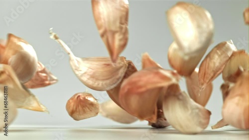 Wallpaper Mural Fresh garlic falls on the table. Filmed on a high-speed camera at 1000 fps. High quality FullHD footage Torontodigital.ca