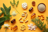  Different pills and herbs on pale orange background, flat lay. Dietary supplements