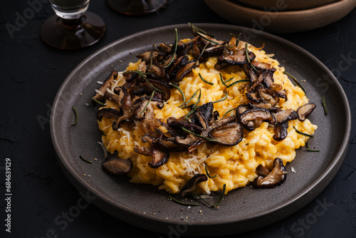Pumpkin risotto with mushrooms, Parmesan cheese and herbs