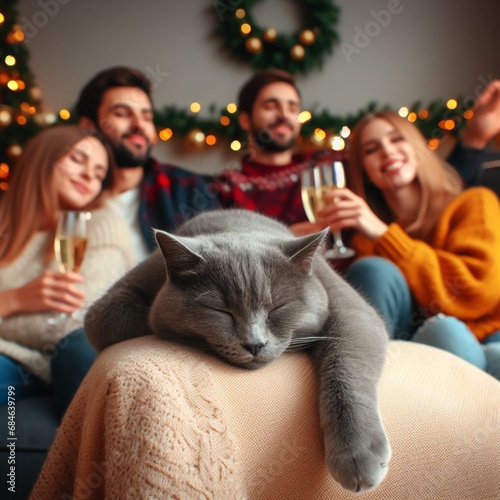  the cat is sleeping on a plaid,the background company is sitting with glasses of champagne 