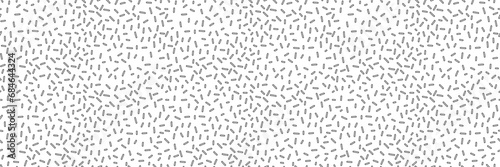 Small dash monochrome seamless pattern. Scattered organic line element on white background. Vector illustration for textile  wallpaper  decor. 