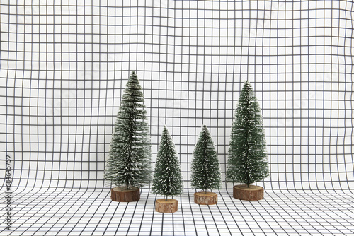 a miniature forest scene composed of several small christmas trees