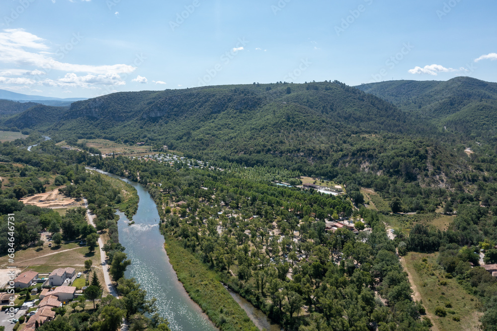 Aerial panorama of a tranquil riverside community France camping