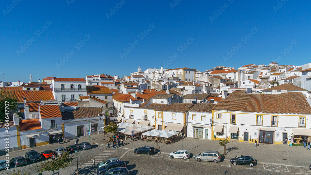 View over clay bricks roof tops the with clear blue sky on a sunny day of old town of Evora, Alentejo, Portugal