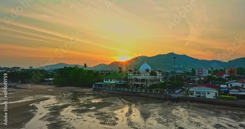 .aerial view scenery stuning sky in sunset above the the mosque..Scene of Colorful romantic sky sunset with Changing the color of the sky background. .beautiful sky at sunset above the mosque photo